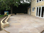 Fordham, Cambridgeshire: Patio with retaining walls for feature planting